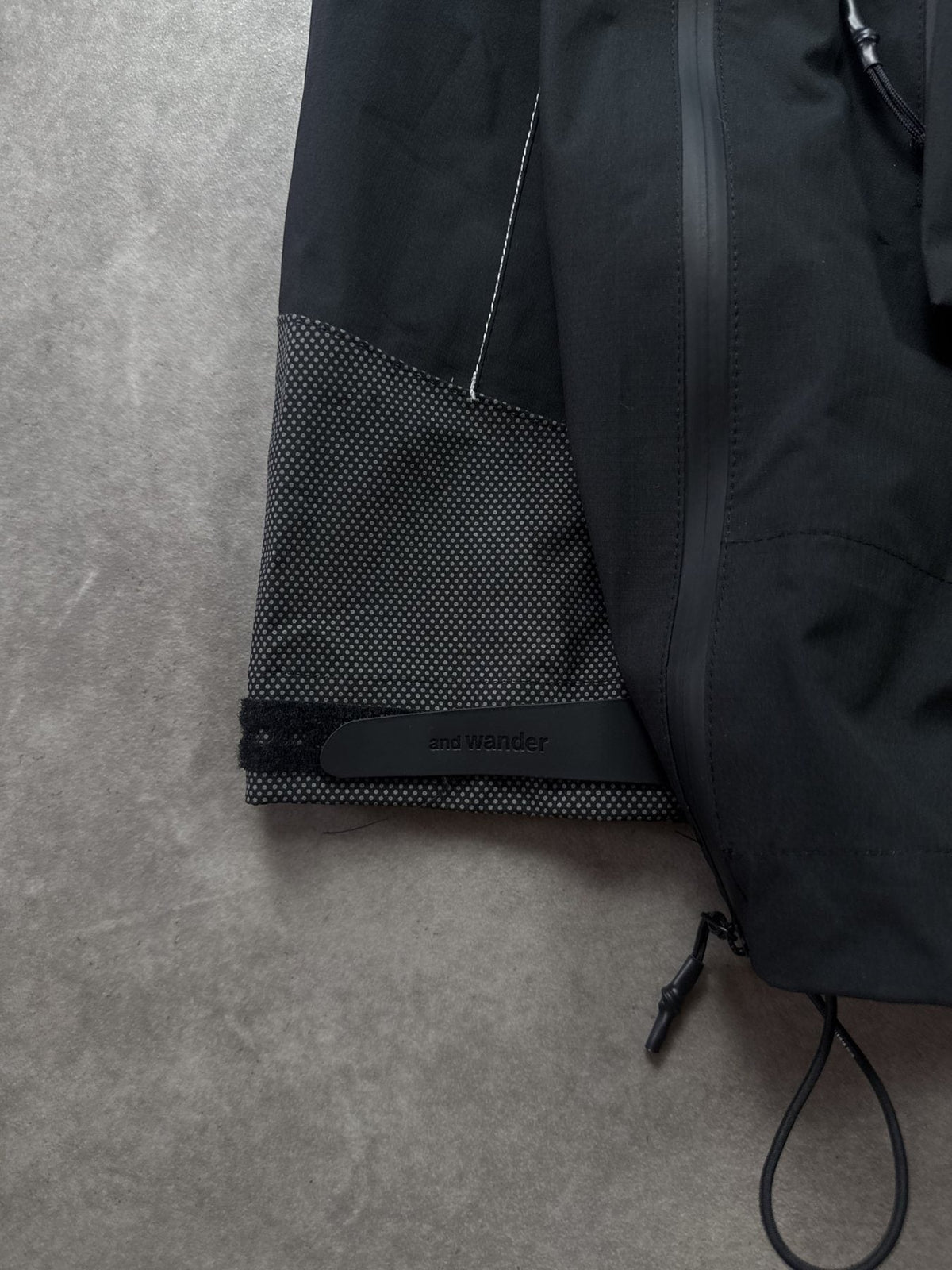 And Wander Pertex Shield Regenjacke Schwarz Gr. M