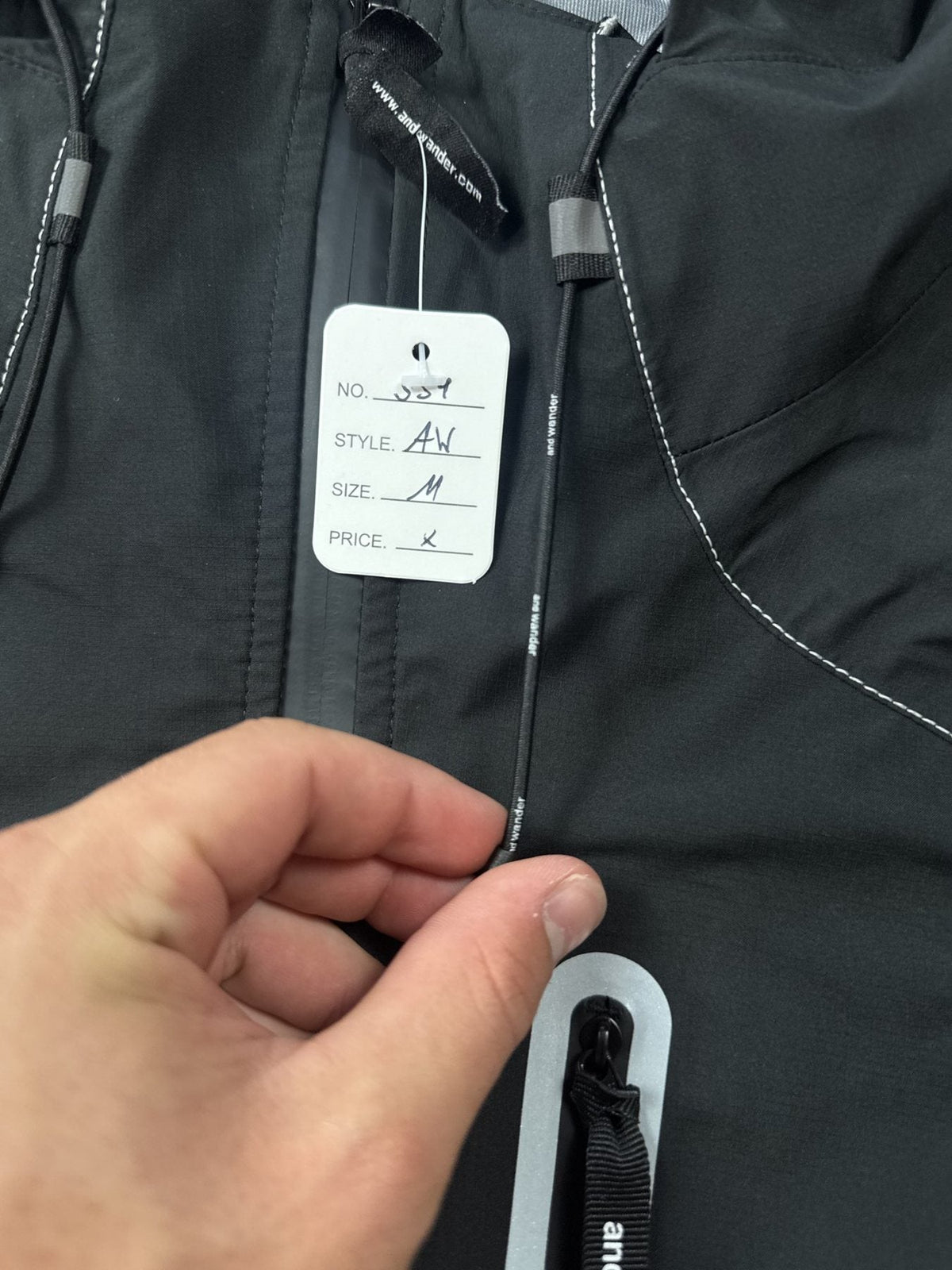 And Wander Pertex Shield Regenjacke Schwarz Gr. M