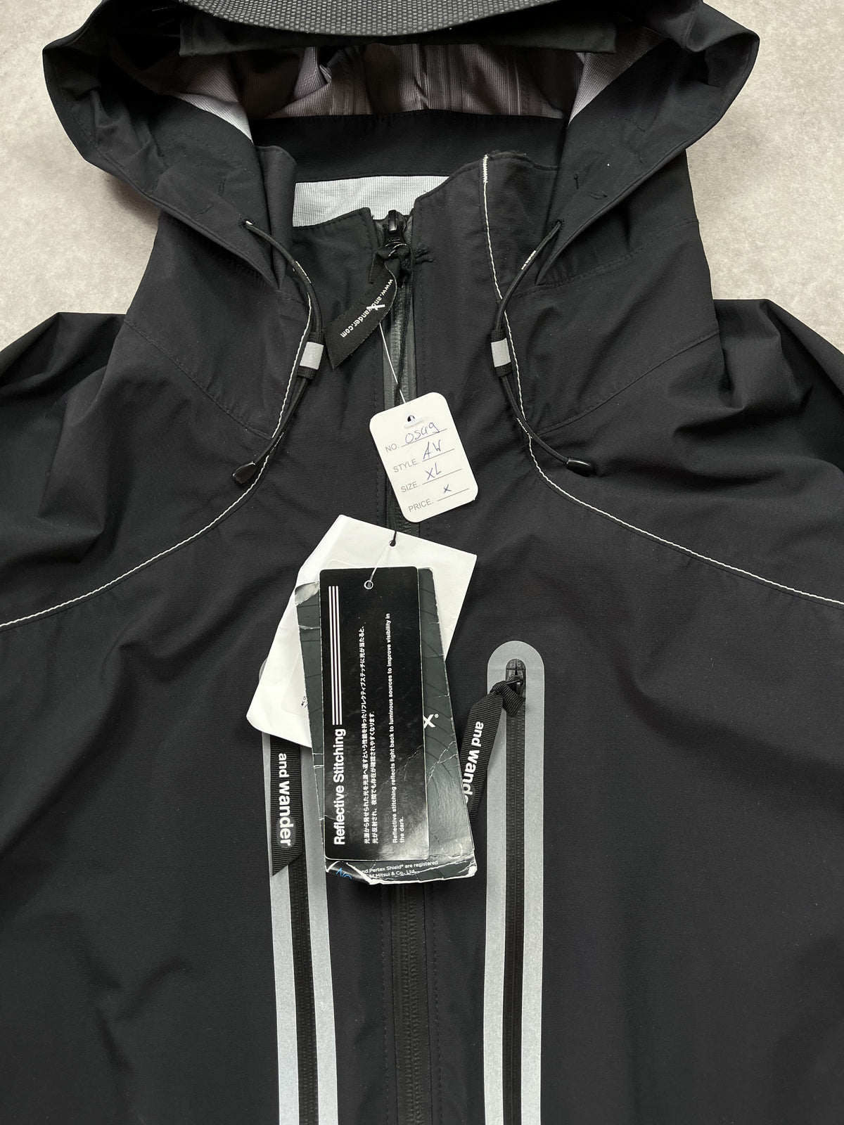 And Wander Pertex Shield Regenjacke Schwarz Gr. XL